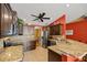 Stylish kitchen features granite countertops, stainless steel appliances, and abundant dark wood cabinetry at 8499 Se 155Th, Summerfield, FL 34491