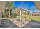 A delightful backyard showcasing a covered patio and lush greenery at 8703 Grandee Dr, Orlando, FL 32829