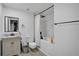 Modern bathroom featuring a tub, shower, contemporary vanity, and updated fixtures at 8703 Grandee Dr, Orlando, FL 32829