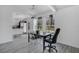 Bright dining area featuring neutral paint, modern light fixture and access to the well-equipped kitchen at 8703 Grandee Dr, Orlando, FL 32829