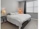 Cozy bedroom with natural light, wood floors, and neutral decor at 8908 Azalea Sands Ln, Davenport, FL 33896