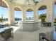 Elegant poolside bar with seating, perfect for entertaining and enjoying community amenities at 8908 Azalea Sands Ln, Davenport, FL 33896