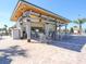 Community poolside bar featuring a covered patio and comfortable seating with easy access to the pool at 8908 Azalea Sands Ln, Davenport, FL 33896