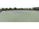 Spacious tennis court ready for play with lush green surroundings at 8908 Azalea Sands Ln, Davenport, FL 33896