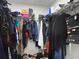 Spacious walk-in closet featuring ample storage and well-organized hanging space for clothes and accessories at 8908 Azalea Sands Ln, Davenport, FL 33896