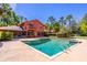 The backyard features a luxurious pool, spa and second story balcony at 160 Archers Pt., Longwood, FL 32779