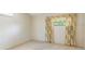 Empty bedroom featuring neutral carpet, light walls, and a window with patterned curtains at 160 Archers Pt., Longwood, FL 32779