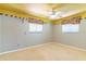 Bedroom featuring beige carpet, neutral walls, and a window with colorful valance at 160 Archers Pt., Longwood, FL 32779
