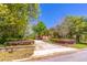 Charming home features a long driveway, mature trees, and well-manicured landscaping at 160 Archers Pt., Longwood, FL 32779
