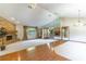 Spacious living room features a stone fireplace, hardwood floors, and bright lighting at 160 Archers Pt., Longwood, FL 32779