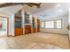 Spacious living room featuring built-in shelves and a large window at 160 Archers Pt., Longwood, FL 32779