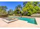 Backyard pool and spa featuring a well-kept patio and beautiful landscaping at 160 Archers Pt., Longwood, FL 32779