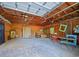Spacious garage with exposed beams, concrete floors, and ample room for storage or a workshop at 1000 Elmwood St, Orlando, FL 32801