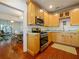 Kitchen with granite countertops, stainless steel appliances, and wood cabinetry at 1000 Elmwood St, Orlando, FL 32801