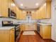 Kitchen with granite countertops, stainless steel appliances, and wood cabinetry at 1000 Elmwood St, Orlando, FL 32801