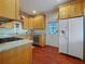 Kitchen with granite countertops, stainless steel appliances, and wood cabinetry at 1000 Elmwood St, Orlando, FL 32801