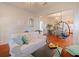 Bright open floor plan featuring a hanging chair, hard wood floors and lots of natural light at 1000 Elmwood St, Orlando, FL 32801