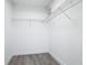 Walk-in closet with installed wire shelving and wood-look flooring at 101 Sandpebble Pl, Sanford, FL 32771