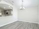 Dining area showcasing modern lighting and easy access to the adjacent stylish kitchen at 101 Sandpebble Pl, Sanford, FL 32771