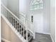 Bright foyer featuring high ceilings, staircase, and a large window for natural light at 101 Sandpebble Pl, Sanford, FL 32771