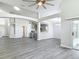 Spacious open-concept living area with modern flooring, neutral walls, and ample natural light at 101 Sandpebble Pl, Sanford, FL 32771