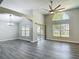 An airy living space with a large window, modern fan, neutral paint, and lots of natural light at 101 Sandpebble Pl, Sanford, FL 32771
