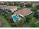 Aerial view of a home, pool, landscaping and neighborhood at 12184 Aztec Rose Ln, Orlando, FL 32827