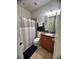 Well-maintained bathroom with neutral tones, vanity, and a shower-tub combination, designed for comfort and style at 12184 Aztec Rose Ln, Orlando, FL 32827