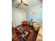 Inviting space with a world map, hardwood floors, and comfortable seating under a modern ceiling fan at 12184 Aztec Rose Ln, Orlando, FL 32827