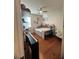 Cozy bedroom featuring hardwood floors, a ceiling fan, and ample natural light at 12184 Aztec Rose Ln, Orlando, FL 32827