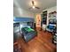 room with bunk beds, a colorful theme, hardwood floors, and a dedicated study area at 12184 Aztec Rose Ln, Orlando, FL 32827