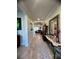 Long foyer with a decorative mirror, console table, tiled floor, and natural lighting at 12184 Aztec Rose Ln, Orlando, FL 32827