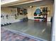 Clean and spacious garage featuring epoxy flooring and ample storage solutions along the walls at 12184 Aztec Rose Ln, Orlando, FL 32827