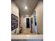 Hallway featuring a built-in workstation, natural lighting and views into other rooms at 12184 Aztec Rose Ln, Orlando, FL 32827