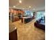 Open-concept kitchen with a large island, granite countertops, stainless appliances, and a nearby Gathering room at 12184 Aztec Rose Ln, Orlando, FL 32827