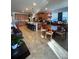 Open concept living area with kitchen island, dining area and living room at 12184 Aztec Rose Ln, Orlando, FL 32827