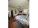 This main bedroom features wood floors, ceiling fan, and an ensuite sitting area at 12184 Aztec Rose Ln, Orlando, FL 32827