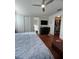 This main bedroom features wood flooring, a ceiling fan, and a large walk-in closet at 12184 Aztec Rose Ln, Orlando, FL 32827