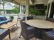 Inviting outdoor patio with a built-in grill, comfortable seating, and a view of the sparkling pool at 12184 Aztec Rose Ln, Orlando, FL 32827