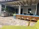 Wonderful outdoor patio with ample seating and a grill ideal for entertaining guests and enjoying the outdoor weather at 12184 Aztec Rose Ln, Orlando, FL 32827