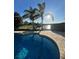 Captivating pool with crystal-clear water and a paver surround, set against a backdrop of palm trees at 12184 Aztec Rose Ln, Orlando, FL 32827