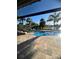 Beautiful private pool surrounded by a brick patio, palm trees, and lush landscaping at 12184 Aztec Rose Ln, Orlando, FL 32827