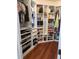 This large walk-in closet features shelving, drawers, and storage for shoes and bags at 12184 Aztec Rose Ln, Orlando, FL 32827