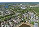 Here's an aerial view of the home located in an established neighborhood near a tranquil pond at 12613 Maribou Cir, Orlando, FL 32828