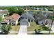 Aerial view of a light blue home with a gray roof, showcasing its inviting curb appeal at 12613 Maribou Cir, Orlando, FL 32828