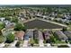 Overhead view of residences, set along a scenic pond, showcasing the tranquil neighborhood setting at 12613 Maribou Cir, Orlando, FL 32828