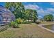 Lush backyard with mature trees, shrubs, and lake access at 12613 Maribou Cir, Orlando, FL 32828