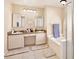 Bathroom showcases double vanity, soaking tub, and separate shower at 12613 Maribou Cir, Orlando, FL 32828