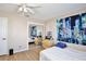 Comfortable bedroom with mirrored closet doors, and wood-look floors at 12613 Maribou Cir, Orlando, FL 32828