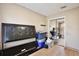 Bedroom featuring wood floors, sliding door closet, and neutral walls at 12613 Maribou Cir, Orlando, FL 32828